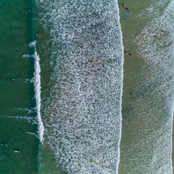 Aerial view of the waves at Polzeath Beach