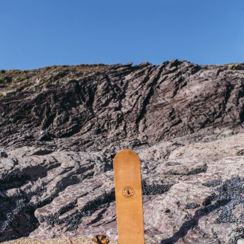 Bellyboard and dog on Polzeath Beach