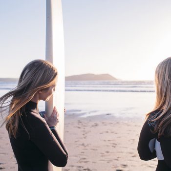 Surfers at Polzeath Beach