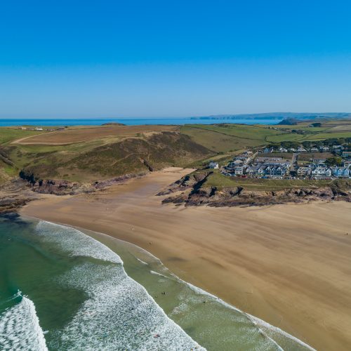 An aerial view of Polzeath Beach and Baby Bay, North Cornwall