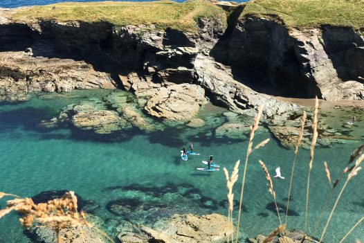 View of kayakers at Port Gaverne, North Cornwall