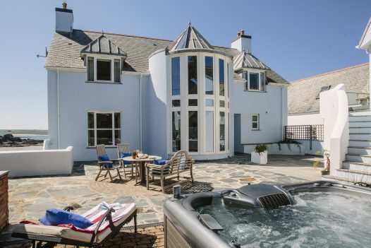 Hot tub and patio at Tristram, a self-catering holiday home in New Polzeath, North Cornwall