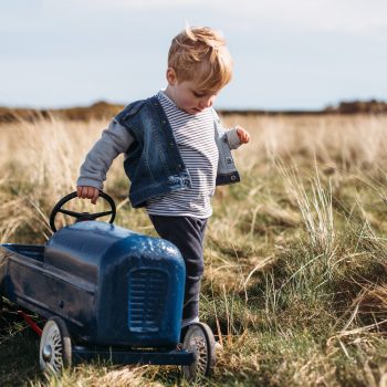 Boy with vintage toy car