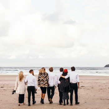 Group enjoying New Year's Eve on Polzeath Beach