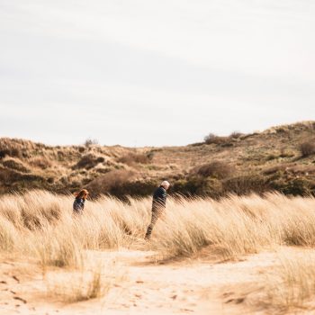 Couple enjoying a winter walk on Rock Beach