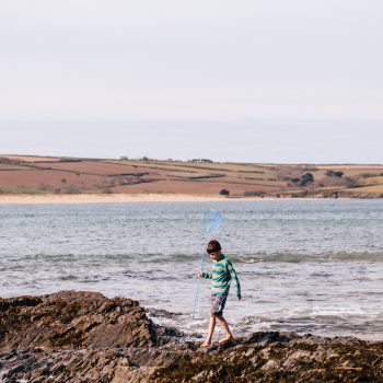 Boy with fishing net at Daymer Bay