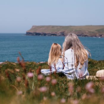 Family on the headland at Polzeath