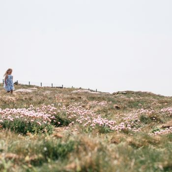 Children running through the seathrift