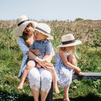 Family on the bench above Greenaway Beach