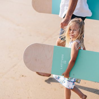 Child with bellyboard on Polzeath Beach