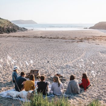 Group sitting on Baby Bay, Polzeath