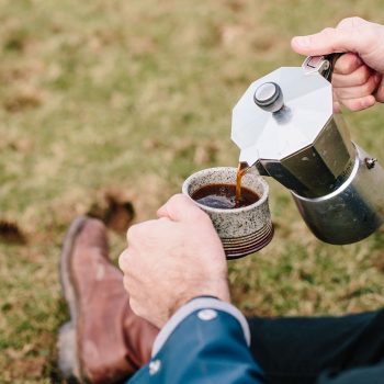A walker with a coffee