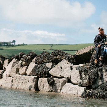 Couple on the sea wall at Rock