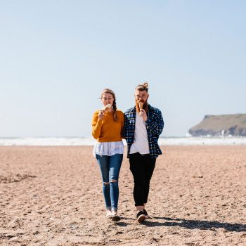 Couple eating an icecream on Polzeath Beach